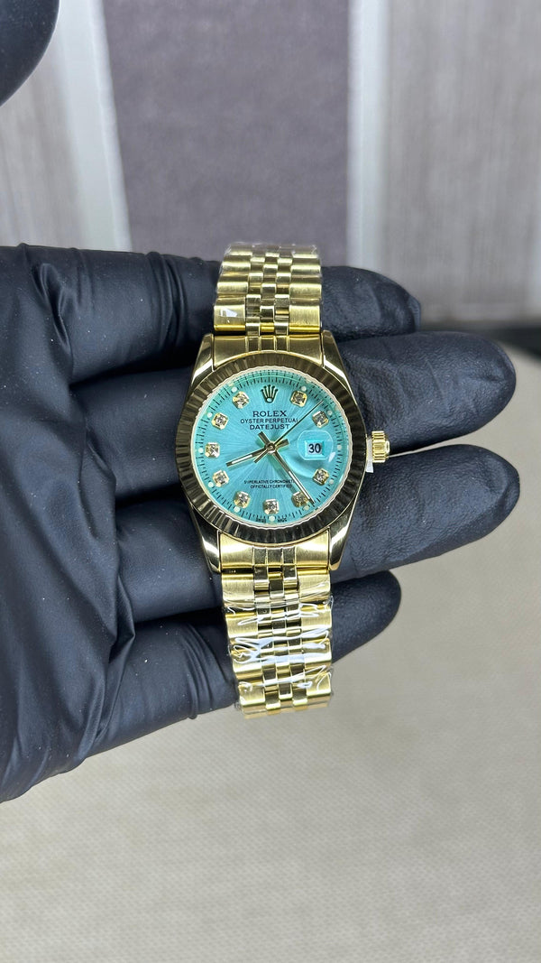 ROLEX GIRL GOLD AND GREEN