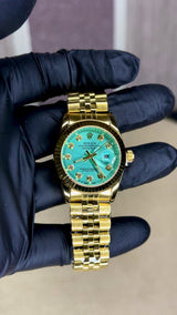 ROLEX GIRL GOLD AND GREEN